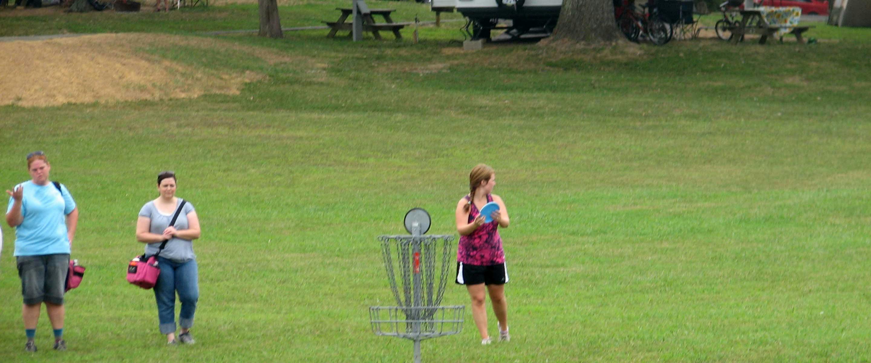group playing frisbee golf
