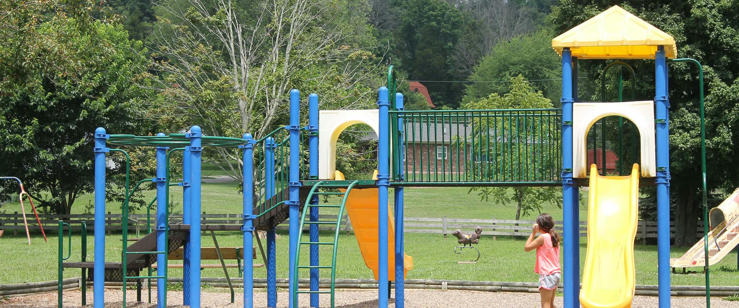 girl playing on playground at Gresham