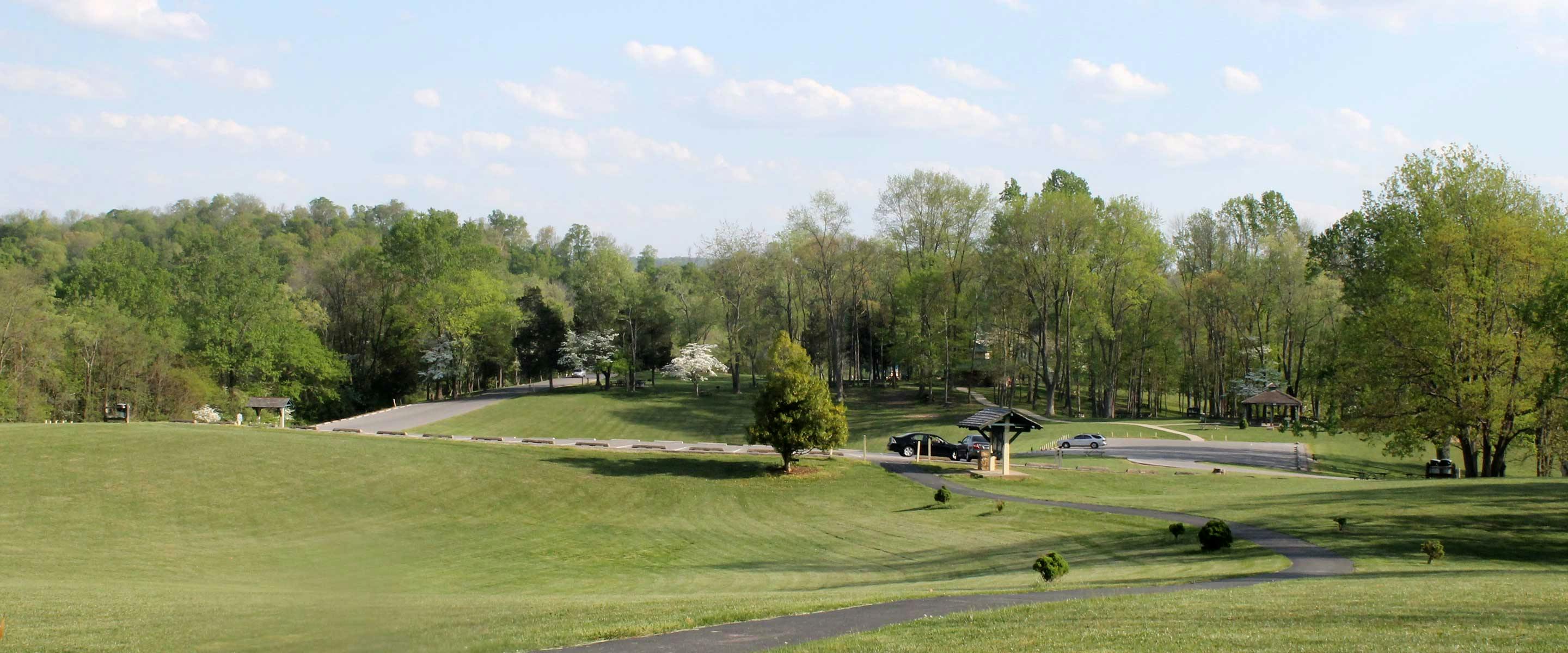 Panoramic view of hillside and paved trail at Hayswood Nature Preserve